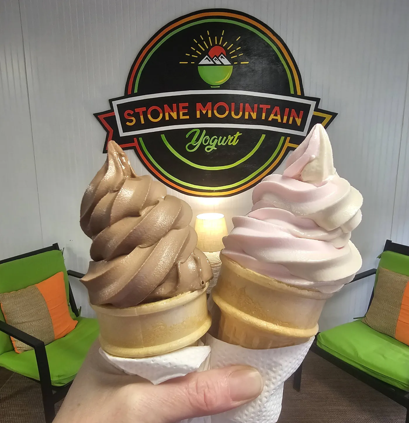Two colorful frozen yogurt cones at Stone Mountain Yogurt